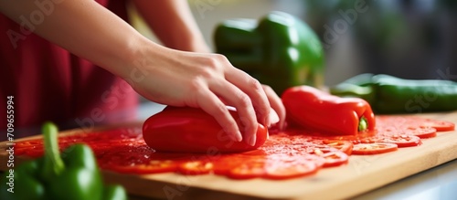 Close up a woman cutting pepper and vegetable on cutting board. Generate AI image