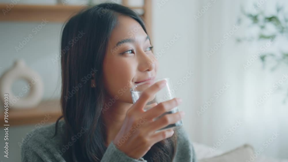 Asian woman drink water start new day with healthy life habit, Female holding glass drinking clean mineral natural still water in living room at home morning, Lifestyle healthcare concept Asian woman drink water start new day with healthy life habit, Female holding glass drinking clean mineral natural still water in living room at home morning, Lifestyle healthcare concept