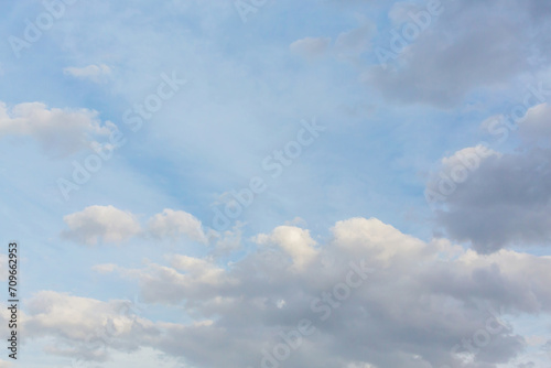 Morning sky. Beautiful fluffy clouds painted in delicate colors at sunrise. Multicolor background or wallpaper