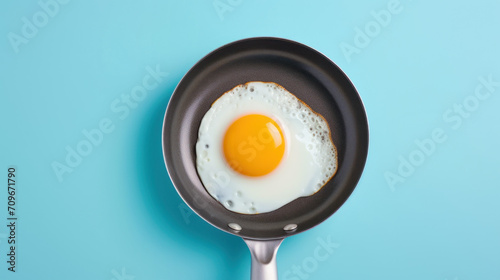 Fried eggs in a pan on a blue background. AI generated.