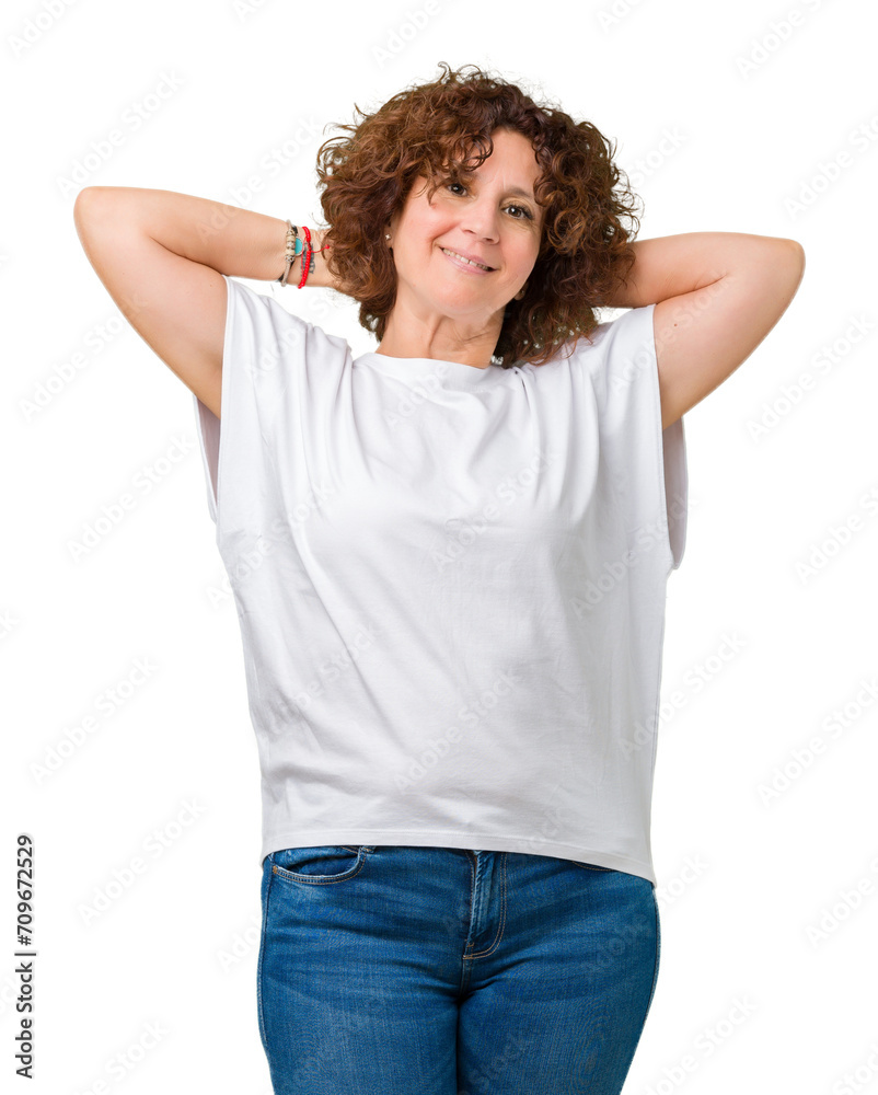 Beautiful middle ager senior woman wearing white t-shirt over isolated background Relaxing and stretching with arms and hands behind head and neck, smiling happy Beautiful middle ager senior woman wearing white t-shirt over isolated background Relaxing and stretching with arms and hands behind head and neck, smiling happy