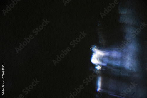 Film texture background with heavy grain, dust and light leakage developed on paper photo