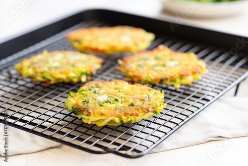 pan-fried broccoli rice patties on cooling rack