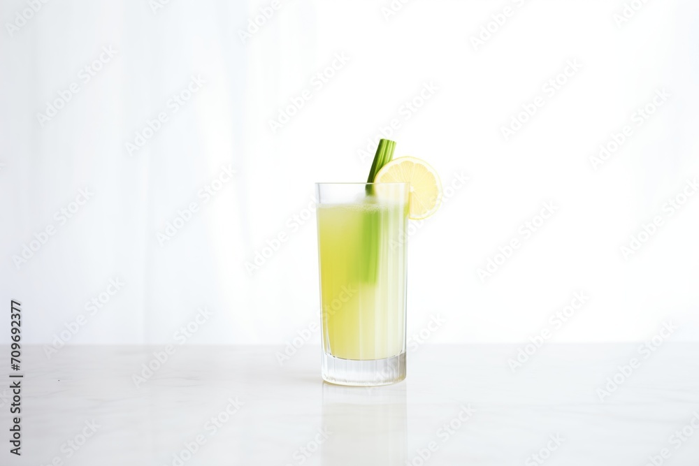 minimalistic celery juice glass on white surface minimalistic celery juice glass on white surface