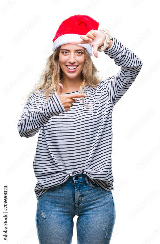 Beautiful young blonde woman wearing christmas hat over isolated background smiling making frame with hands and fingers with happy face. Creativity and photography concept. Beautiful young blonde woman wearing christmas hat over isolated background smiling making frame with hands and fingers with happy face. Creativity and photography concept.