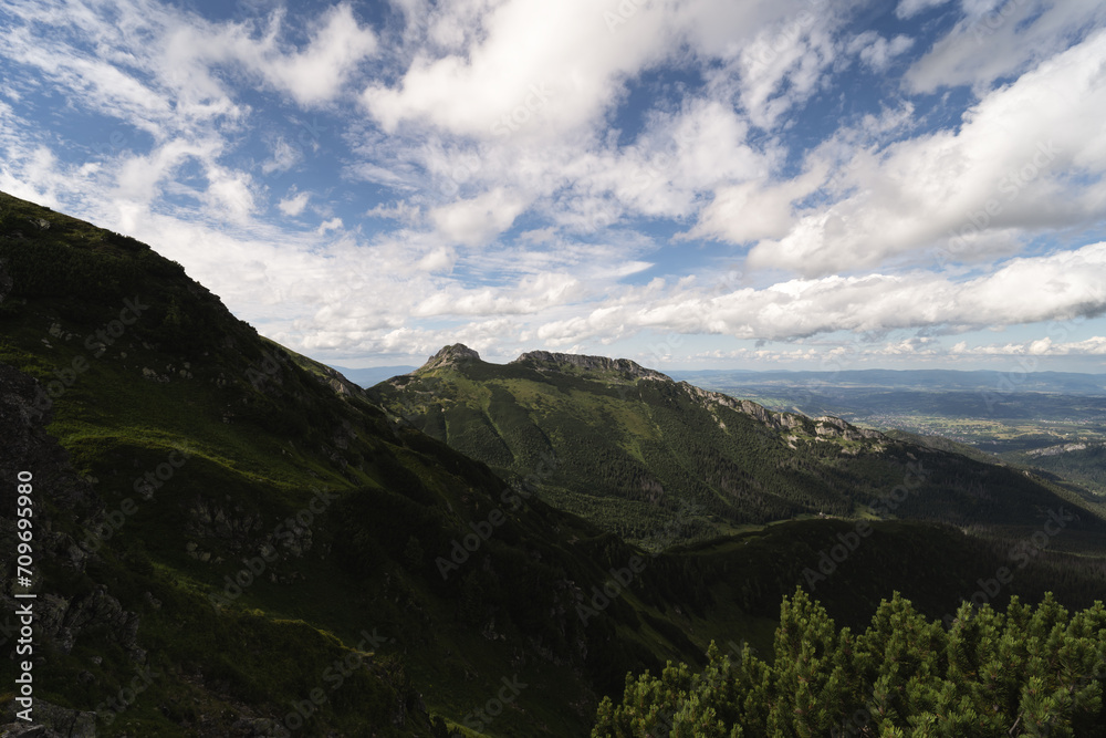 Mountain landscape in the Polish Tatras in summer, green hills and sky with clouds. Mountain landscape in the Polish Tatras in summer, green hills and sky with clouds.