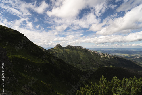 Fototapeta Naklejka Na Ścianę i Meble -  Mountain landscape in the Polish Tatras in summer, green hills and sky with clouds.