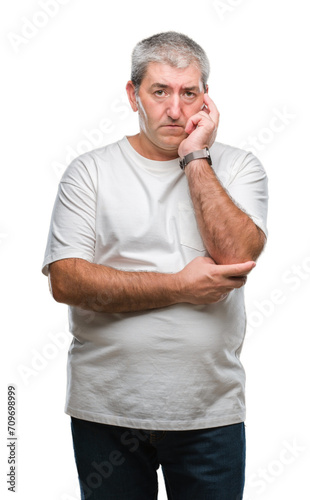 Handsome senior man over isolated background thinking looking tired and bored with depression problems with crossed arms.