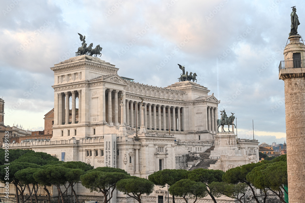  Emmanuel II monument and The Altare della Patria.Trajan Column and Facade of the Victorian in Rome, Italy  during the day at sunset.