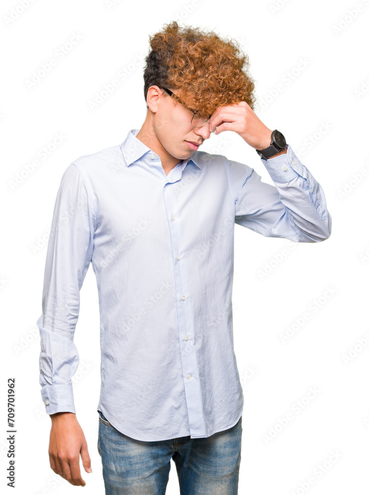 Young handsome business man with afro wearing glasses tired rubbing nose and eyes feeling fatigue and headache. Stress and frustration concept. Young handsome business man with afro wearing glasses tired rubbing nose and eyes feeling fatigue and headache. Stress and frustration concept.