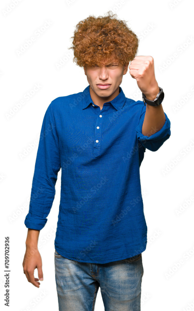 Young handsome elegant man with afro hair angry and mad raising fist frustrated and furious while shouting with anger. Rage and aggressive concept. Young handsome elegant man with afro hair angry and mad raising fist frustrated and furious while shouting with anger. Rage and aggressive concept.