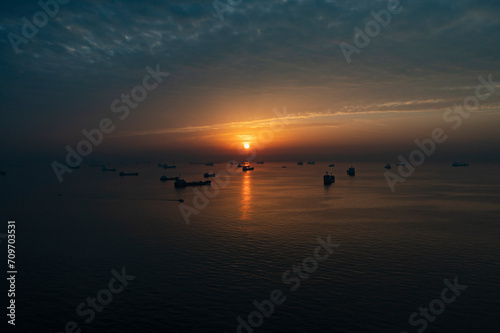 Ships waiting at sea at sunset © pogina