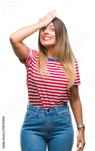 Young beautiful woman casual look over isolated background surprised with hand on head for mistake, remember error. Forgot, bad memory concept.