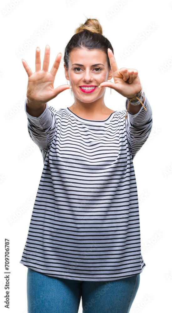 Young beautiful woman casual stripes sweater over isolated background showing and pointing up with fingers number seven while smiling confident and happy.