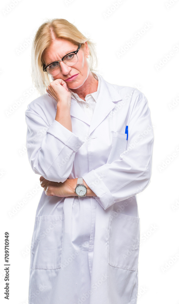 Middle age blonde therapist woman wearing white coat over isolated background thinking looking tired and bored with depression problems with crossed arms. Middle age blonde therapist woman wearing white coat over isolated background thinking looking tired and bored with depression problems with crossed arms.