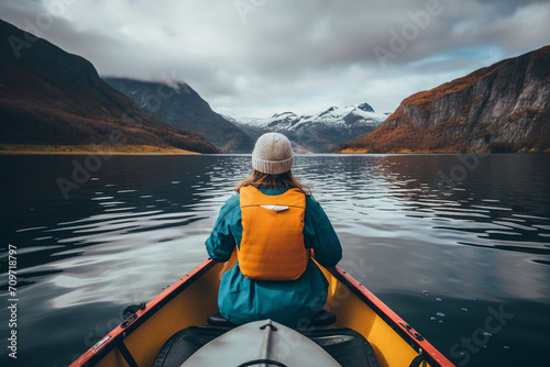 Generative AI picture of person rowing on a calm lake in autumn water and forest around © Tetiana