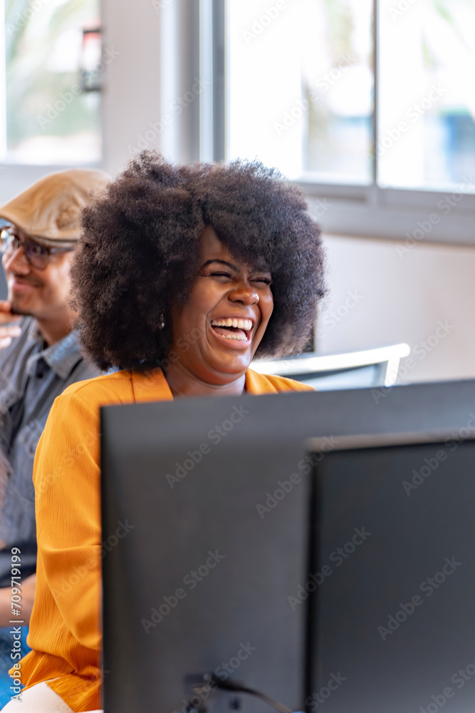Happy businesswoman smiling while working in the office. Business concept. Happy businesswoman smiling while working in the office. Business concept.