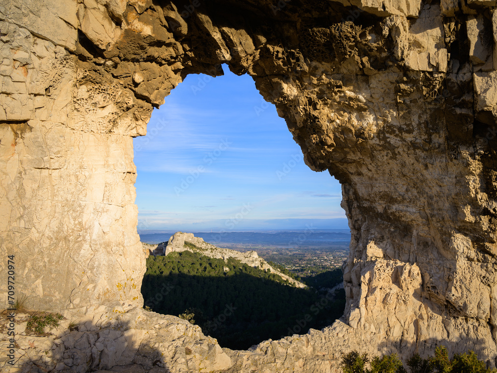 Massive rock formation with a big hole in the Alpilles