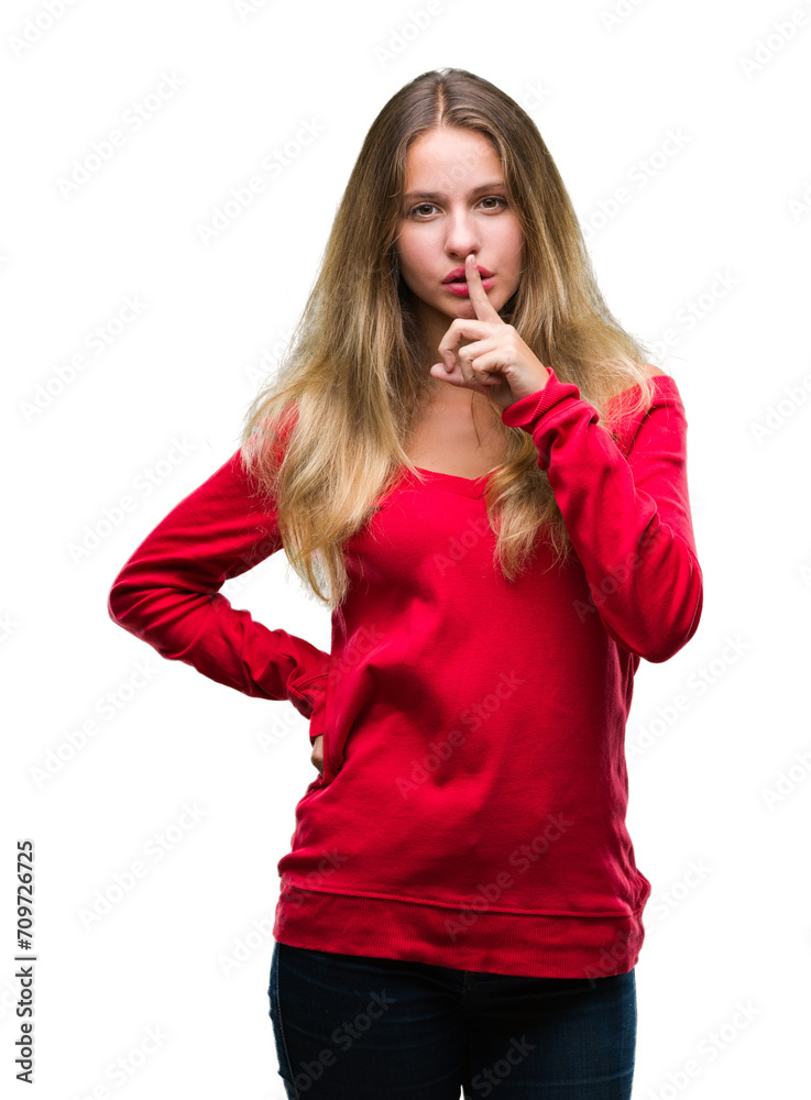 Young beautiful blonde woman wearing red sweater over isolated background asking to be quiet with finger on lips. Silence and secret concept. Young beautiful blonde woman wearing red sweater over isolated background asking to be quiet with finger on lips. Silence and secret concept.