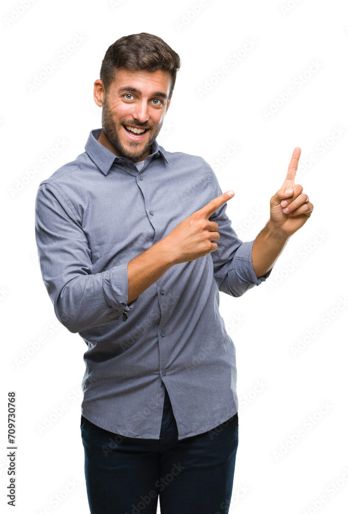 Young handsome man over isolated background smiling and looking at the camera pointing with two hands and fingers to the side. Young handsome man over isolated background smiling and looking at the camera pointing with two hands and fingers to the side.