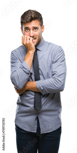 Young handsome business man over isolated background looking stressed and nervous with hands on mouth biting nails. Anxiety problem.