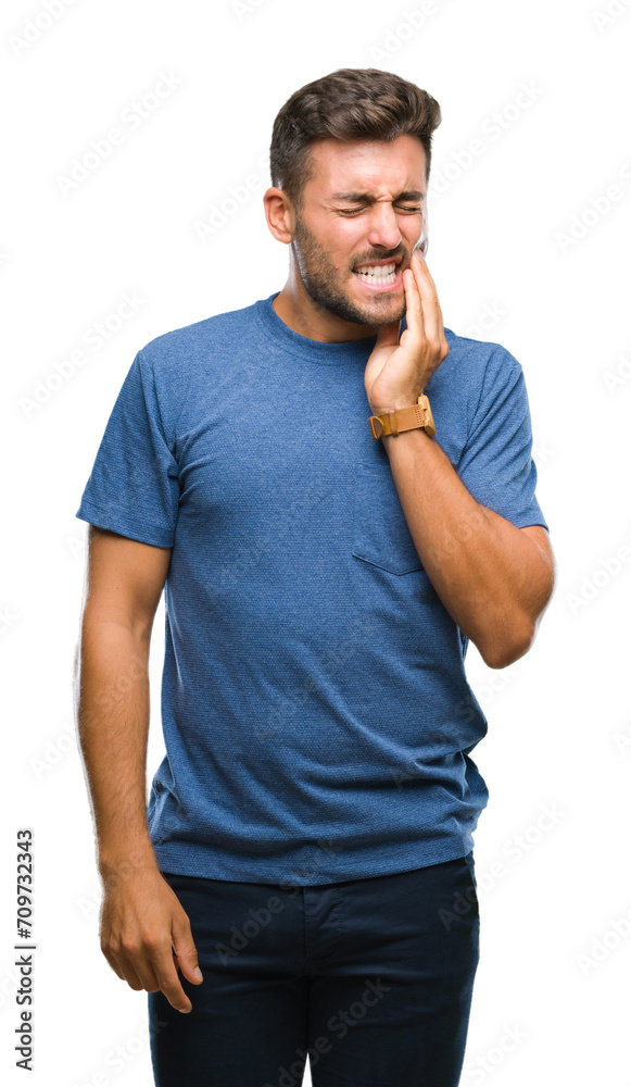 Young handsome man over isolated background touching mouth with hand with painful expression because of toothache or dental illness on teeth. Dentist concept.