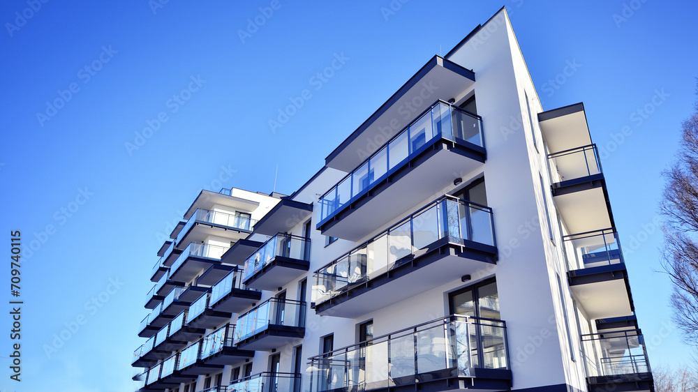 Obraz premium Residential area with modern apartment building. Multi Storey modern, new and stylish living block of flats.