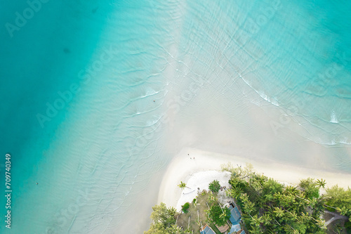 Aerial view of beautiful tropical island beach with emerald water at Koh Kood Thailand.