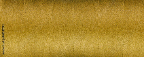 texture of thread for a sewing machine orange colors on a white background