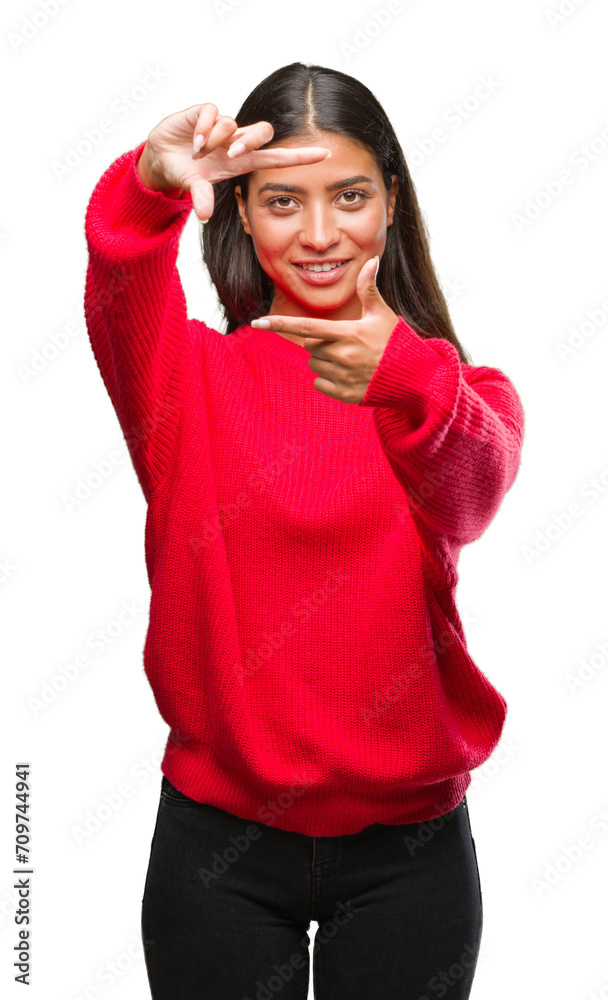 Young beautiful arab woman wearing winter sweater over isolated background smiling making frame with hands and fingers with happy face. Creativity and photography concept. Young beautiful arab woman wearing winter sweater over isolated background smiling making frame with hands and fingers with happy face. Creativity and photography concept.