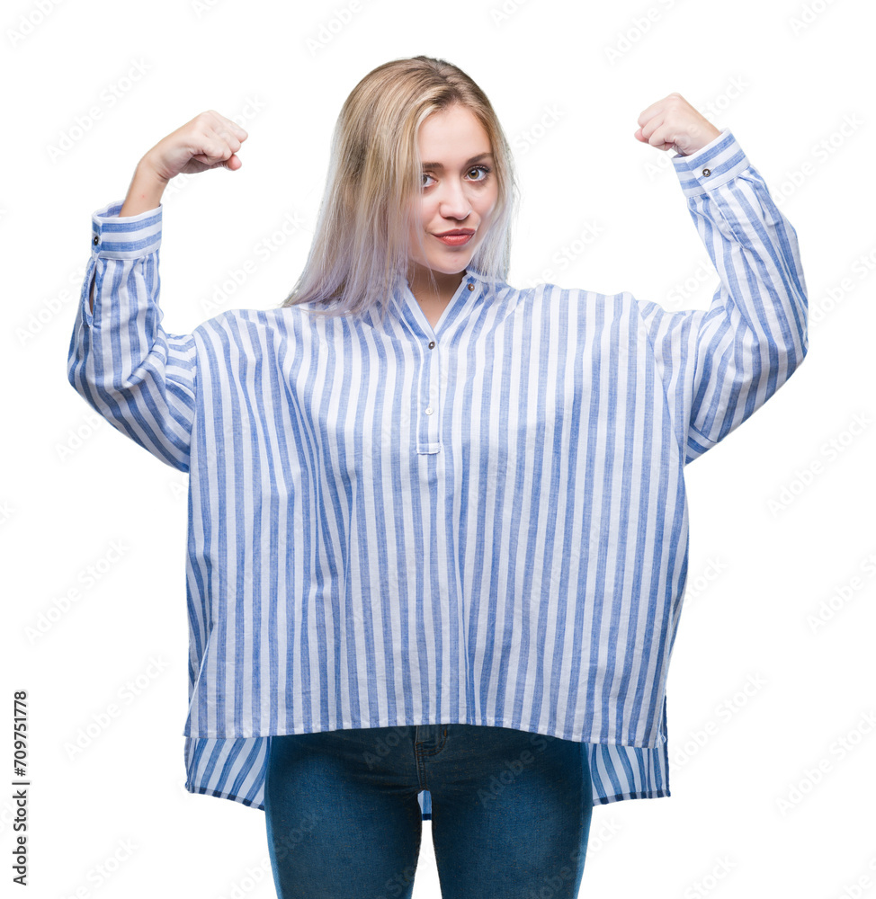Fototapeta premium Young blonde woman over isolated background showing arms muscles smiling proud. Fitness concept.