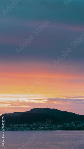 Alesund, Norway. Amazing Natural Bright Dramatic Sky In Warm Colours Above Alesund Valderoya And Islands In Sunset Time. Colorful Sky Background. Beauty In Norwegian Nature. . photo