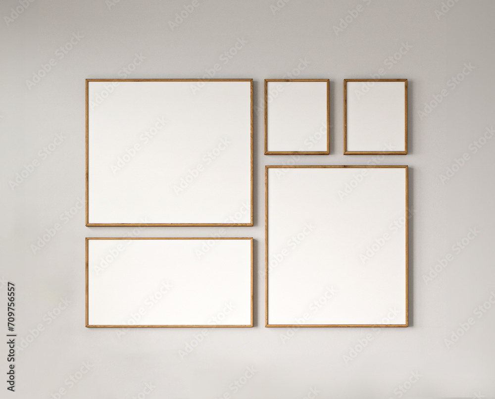 Modern gallery wall with a collection of empty picture frames on a muted background Modern gallery wall with a collection of empty picture frames on a muted background