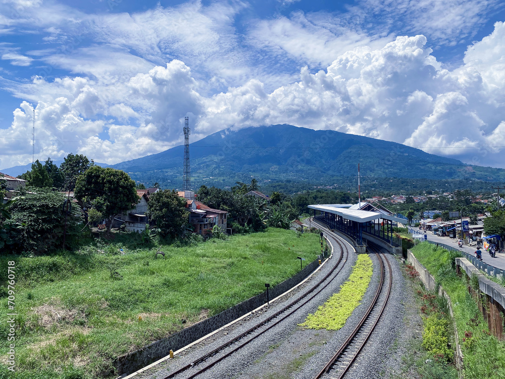 Cigombong, Indonesia ( January 15, 2024): Cigombong train station building with Views of Mount Salak.