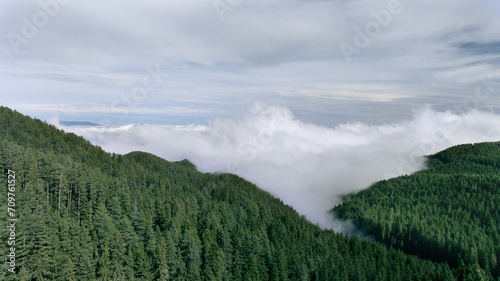 Aerial shot of valley fog in Pirin Mountains covering Razlog valley on an autumn day.