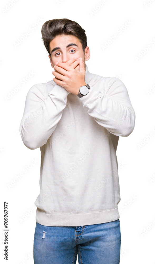 Young handsome man wearing turtleneck sweater over isolated background shocked covering mouth with hands for mistake. Secret concept. Young handsome man wearing turtleneck sweater over isolated background shocked covering mouth with hands for mistake. Secret concept.