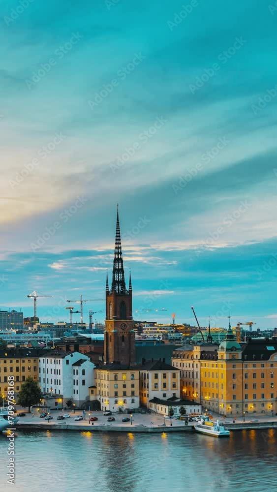Stockholm, Sweden. Scenic View Of Stockholm Skyline At Summer Evening. Famous Popular Destination Scenic Place In Dusk Lights. Riddarholm Church Day To Night Transition Time Lapse Stockholm, Sweden. Scenic View Of Stockholm Skyline At Summer Evening. Famous Popular Destination Scenic Place In Dusk Lights. Riddarholm Church Day To Night Transition Time Lapse