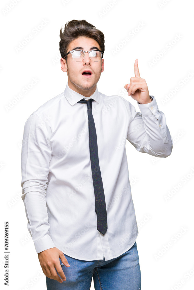 Young business man wearing glasses over isolated background pointing finger up with successful idea. Exited and happy. Number one. Young business man wearing glasses over isolated background pointing finger up with successful idea. Exited and happy. Number one.