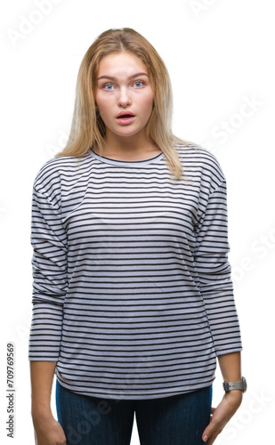 Young caucasian woman over isolated background afraid and shocked with surprise expression, fear and excited face.