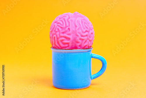 Human Brain in a Camping Mug on Yellow