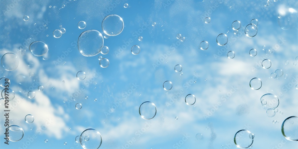 Soap bubbles on the blue sky background. Eco friendly cleaning service background. 