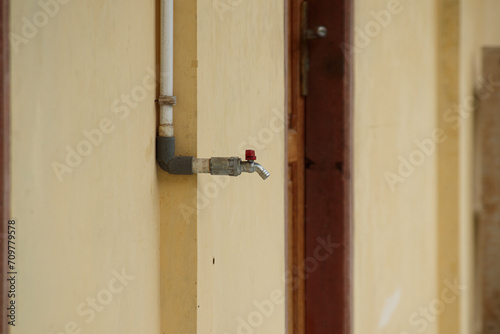photo of a water tap on the terrace of a school