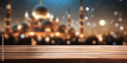 wooden table on a blurred background with a mosque and bokeh lights, Ramadan Kareem #709785547