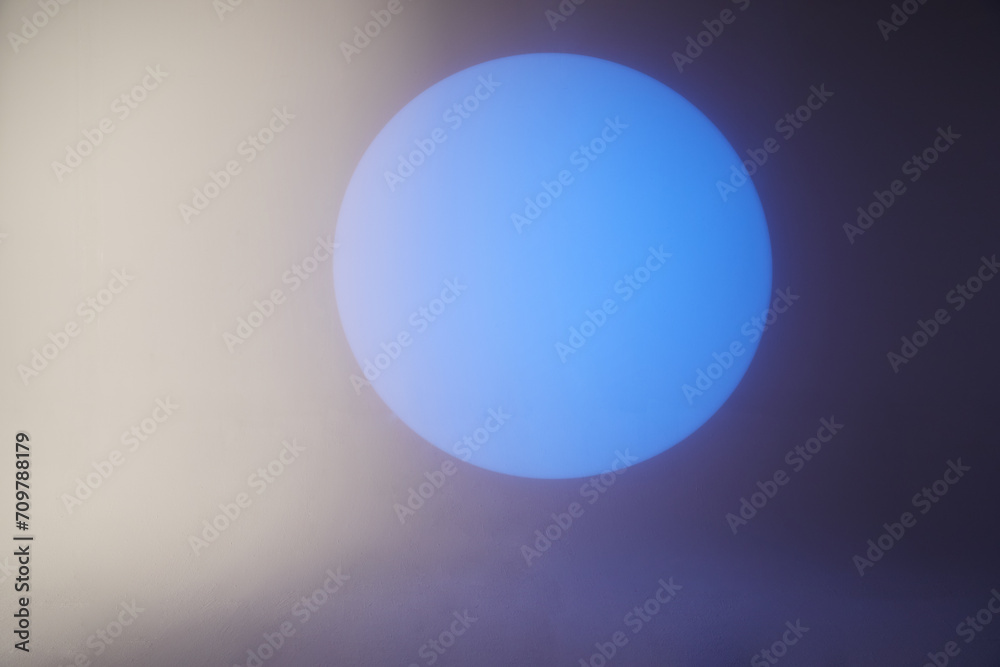 Blue spot light on white background, abstract geometric background.