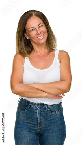 Beautiful middle age casual adult woman over isolated background happy face smiling with crossed arms looking at the camera. Positive person.