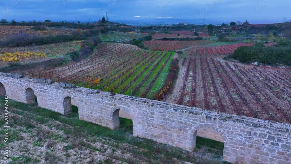 San Andrés de Muga aqueduct between vineyards in autumn in Labastida in the province of Alava. Aerial view from a drone. Basque Country, Spain, Europe San Andrés de Muga aqueduct between vineyards in autumn in Labastida in the province of Alava. Aerial view from a drone. Basque Country, Spain, Europe