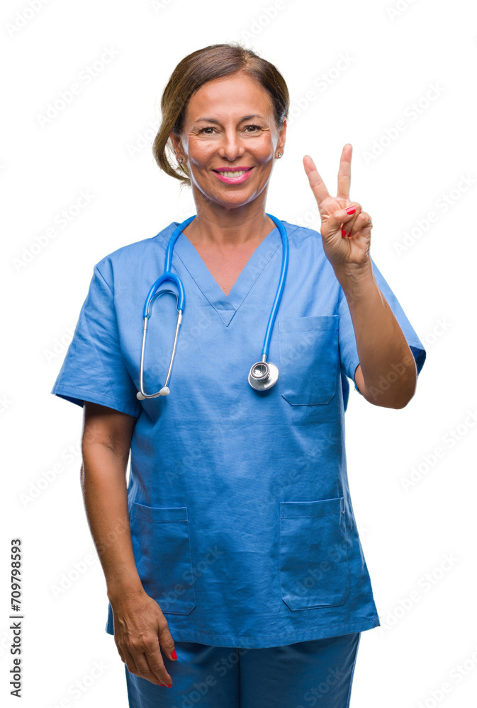 Middle age senior nurse doctor woman over isolated background showing and pointing up with fingers number two while smiling confident and happy. Middle age senior nurse doctor woman over isolated background showing and pointing up with fingers number two while smiling confident and happy.