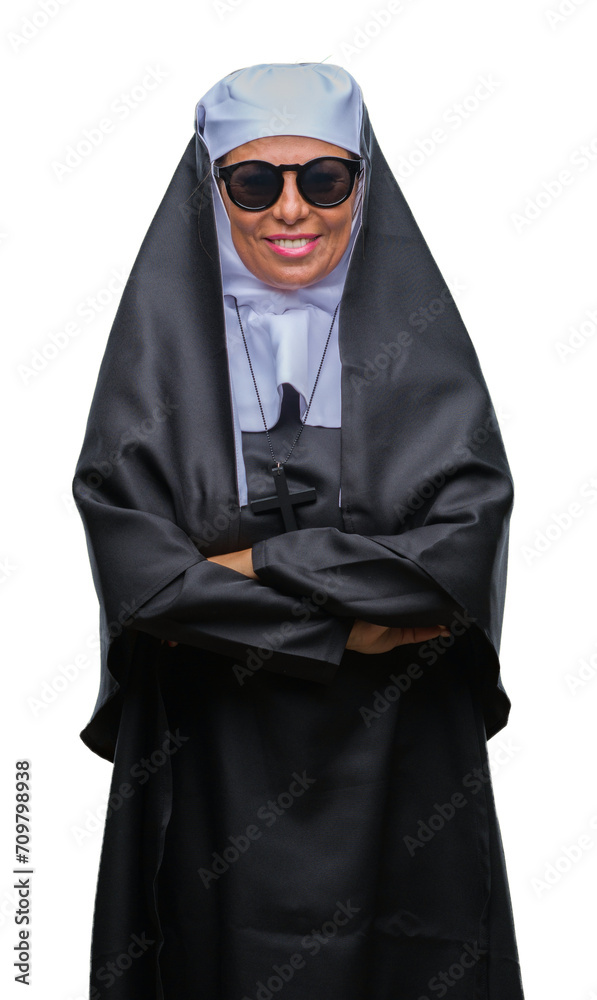 Middle age senior catholic nun woman wearing sunglasses over isolated background happy face smiling with crossed arms looking at the camera. Positive person. Middle age senior catholic nun woman wearing sunglasses over isolated background happy face smiling with crossed arms looking at the camera. Positive person.