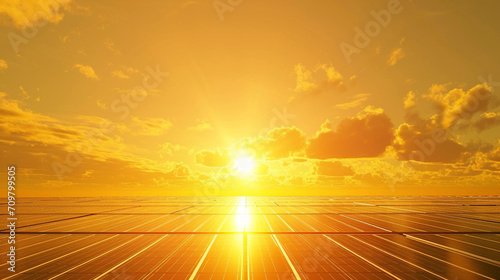 Illustration of a black futuristic field of sola panelsr, bright yellow-orange futuristic background with the sun.