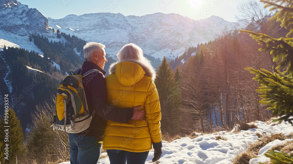 Senior couple walking in the winter mountains - Travel concept - Soft focus on man face - Model by AI generative